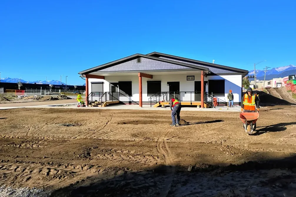 The new daycare building with graded ground being prepared in front