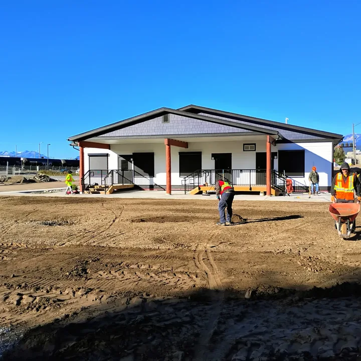 The new daycare building with graded ground being prepared in front